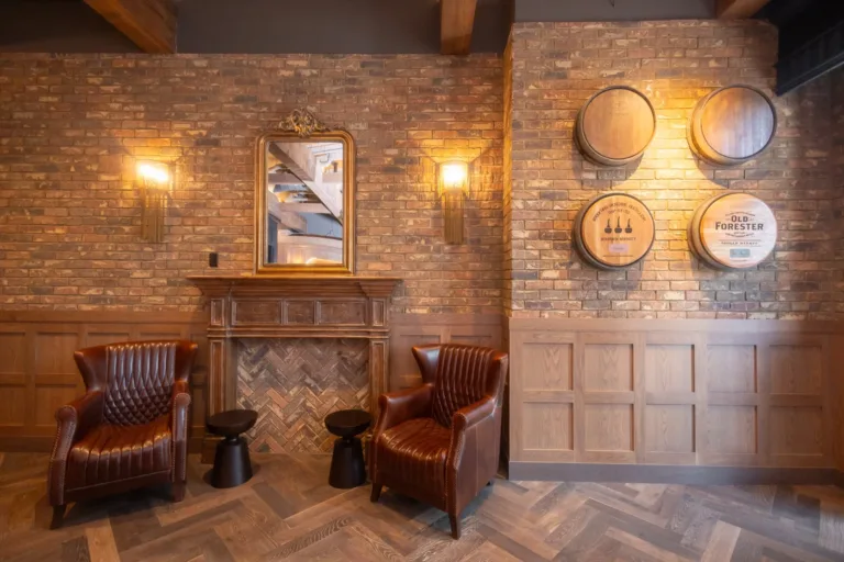 Bar Clara seating area against original brick